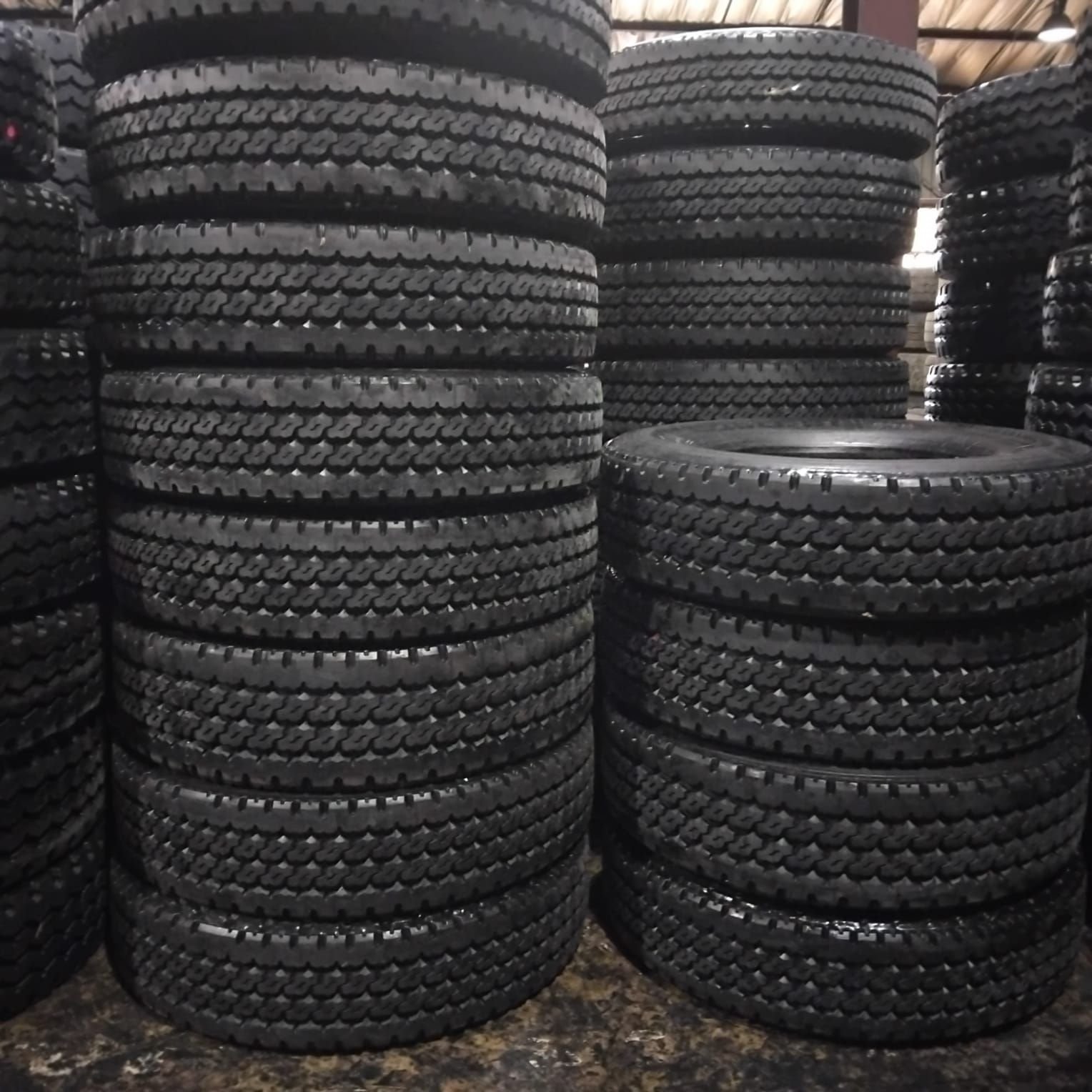 Stacks of 315/80R22.5 M90 stock retreads